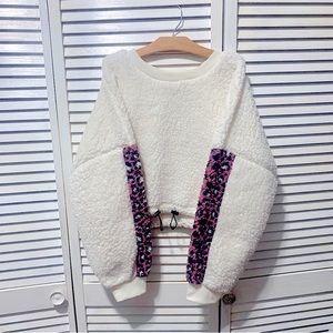 Sherpa crop sweater with drawstring adjustment & pink cheetah print sleevs